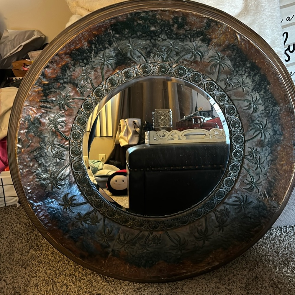 Solid wood . Moderately heavy mirror